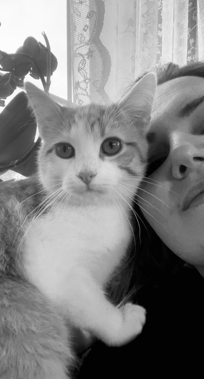 Mary cuddling a cat
